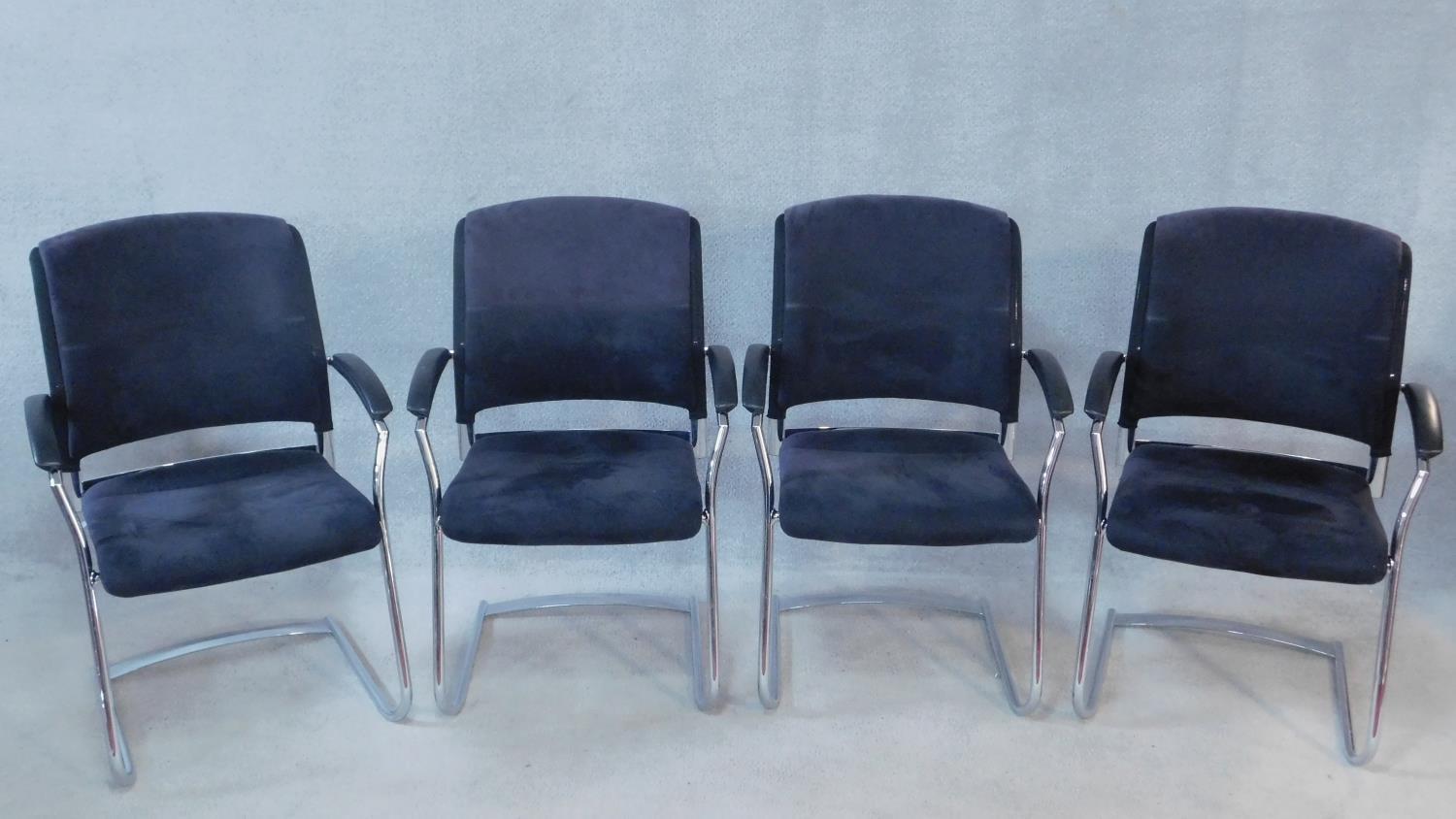 A set of four boardroom armchairs for Interstuhl in mesh and faux suede upholstery on chromium