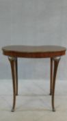 An Edwardian mahogany shaped top occasional table on slender cabriole supports. H.71 W.77 D.50cm