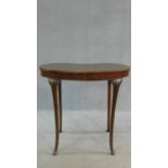 An Edwardian mahogany shaped top occasional table on slender cabriole supports. H.71 W.77 D.50cm