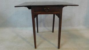 A Georgian mahogany Pembroke table fitted with frieze drawer on square supports. H.70 W.84 D.69cm