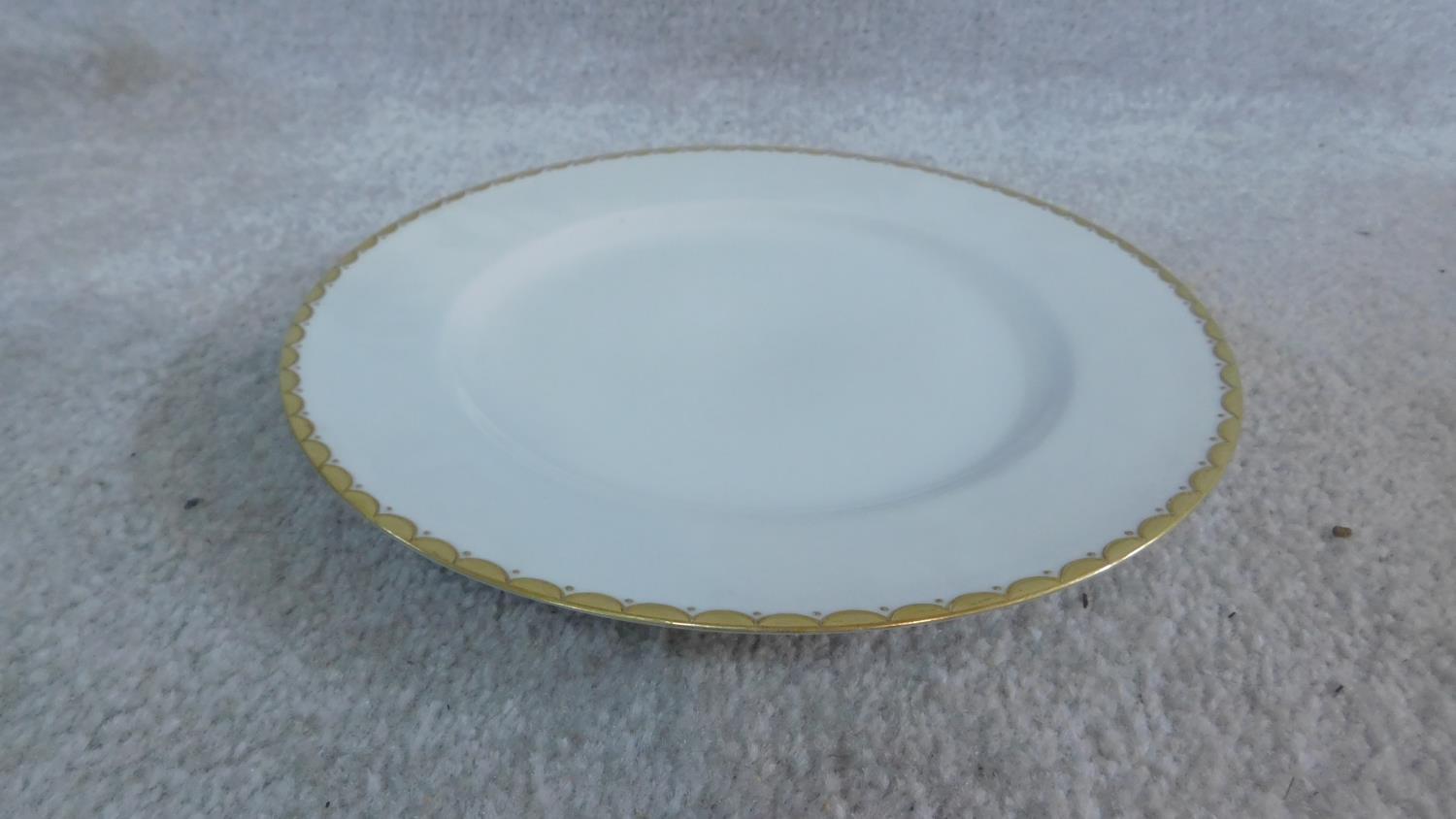 An extensive dinner service in white porcelain and gilt highlighted rims, marked Epiag, - Image 7 of 10