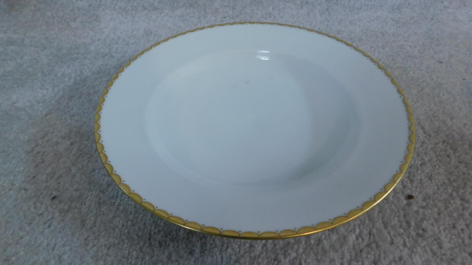 An extensive dinner service in white porcelain and gilt highlighted rims, marked Epiag, - Image 6 of 10