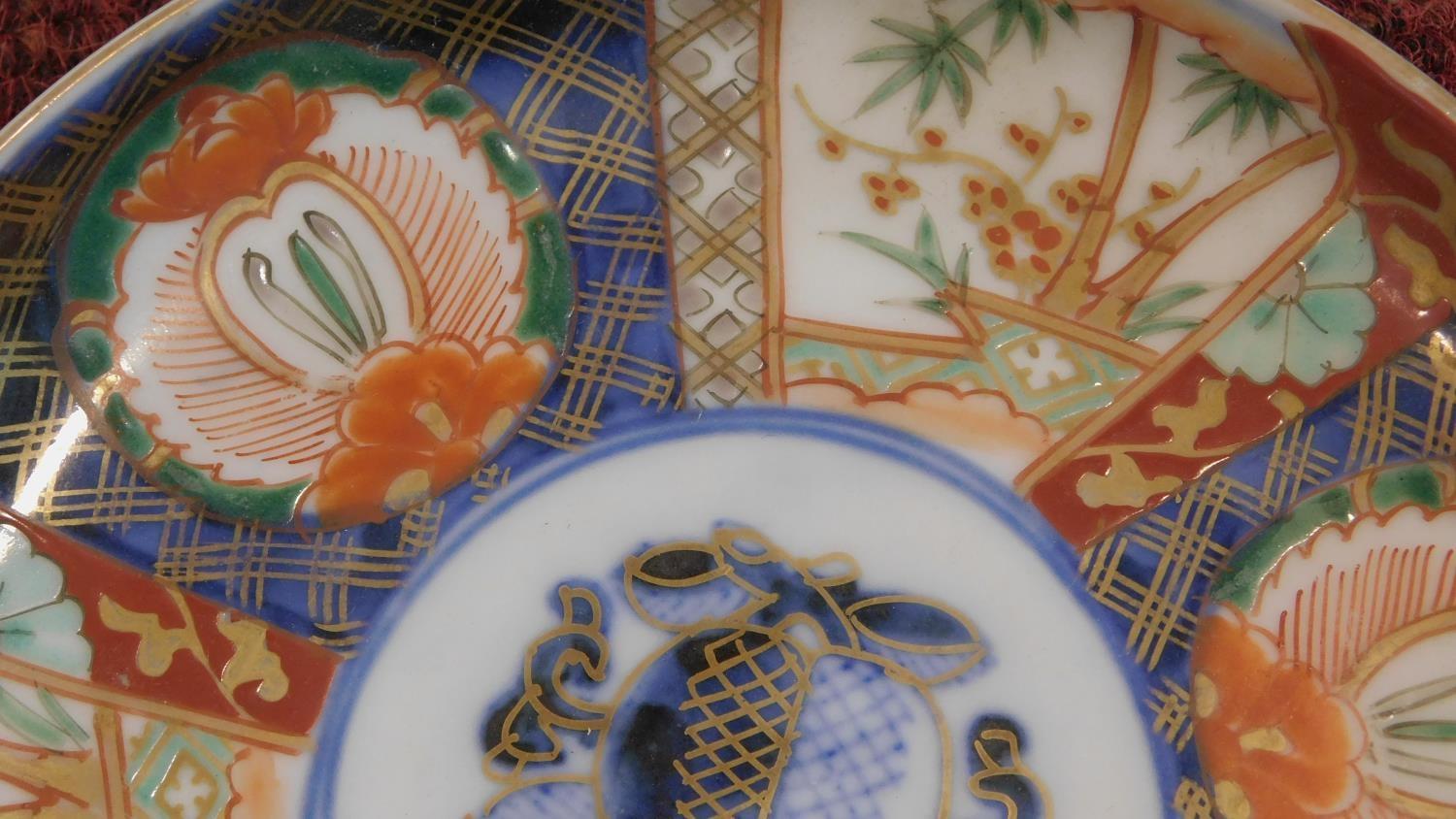 Two 19th century Arita Imari Japanese porcelain plates. One with six white cartouches, each hand - Image 5 of 7