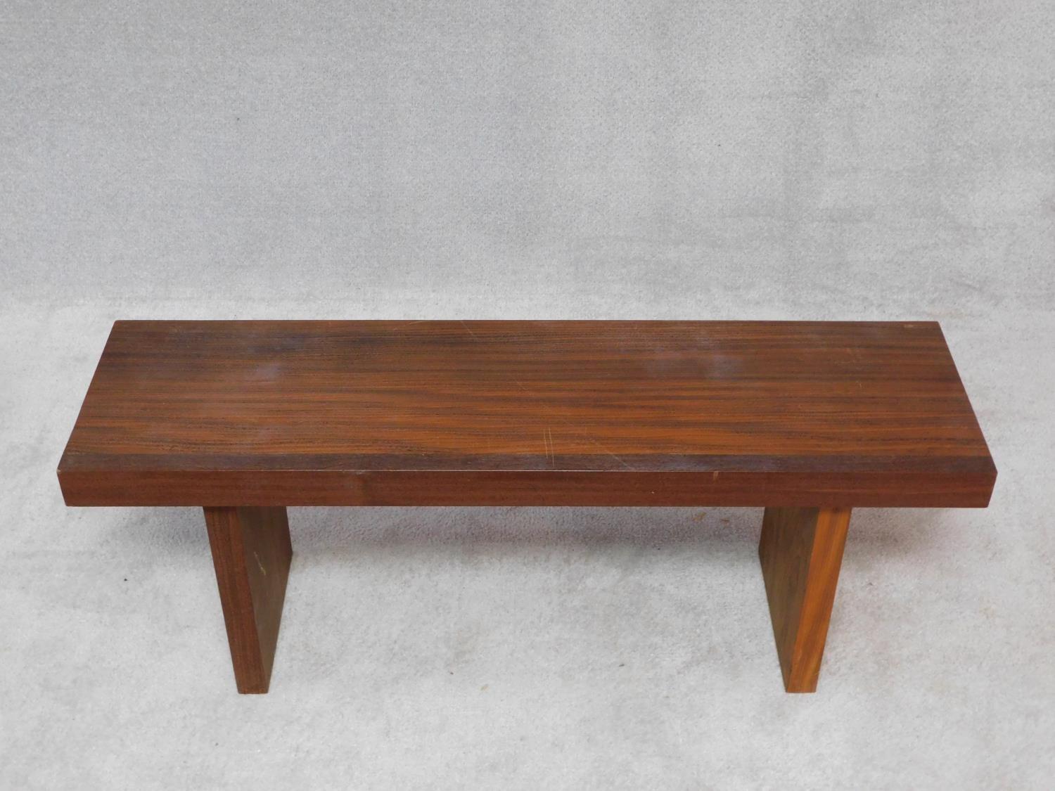 A pair of African hardwood benches with planked tops on block trestle supports. H.47 W.104 D.42cm - Image 3 of 3