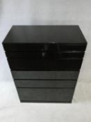 A 1980's vintage Cappellini chest of five drawers above cabniet doors in high gloss black