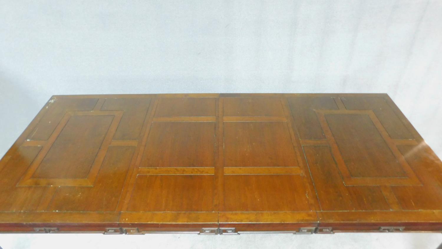 A Chinese hardwood extending dining table with parquetry top above carved frieze on square - Image 5 of 6