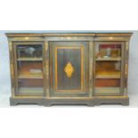 A late Victorian ebonised and satinwood inlaid credenza with ormolu mounts and central panel door