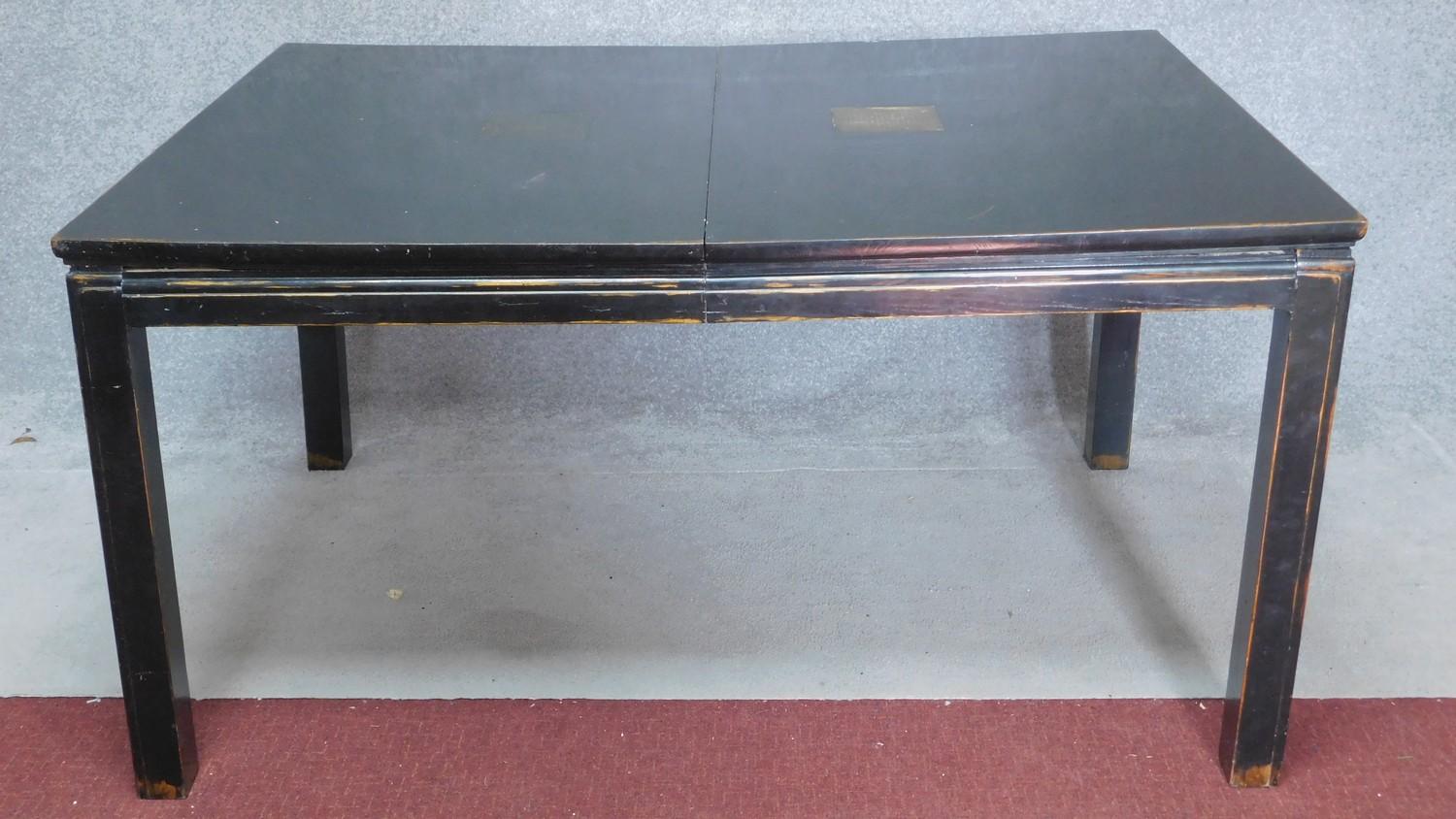 A Chinese ebonised and lacquered extending dining table with four extra leaves on square section - Image 4 of 4