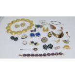 A collection of costume jewellery. Including a garnet and silver filigree scarf pin, a vintage