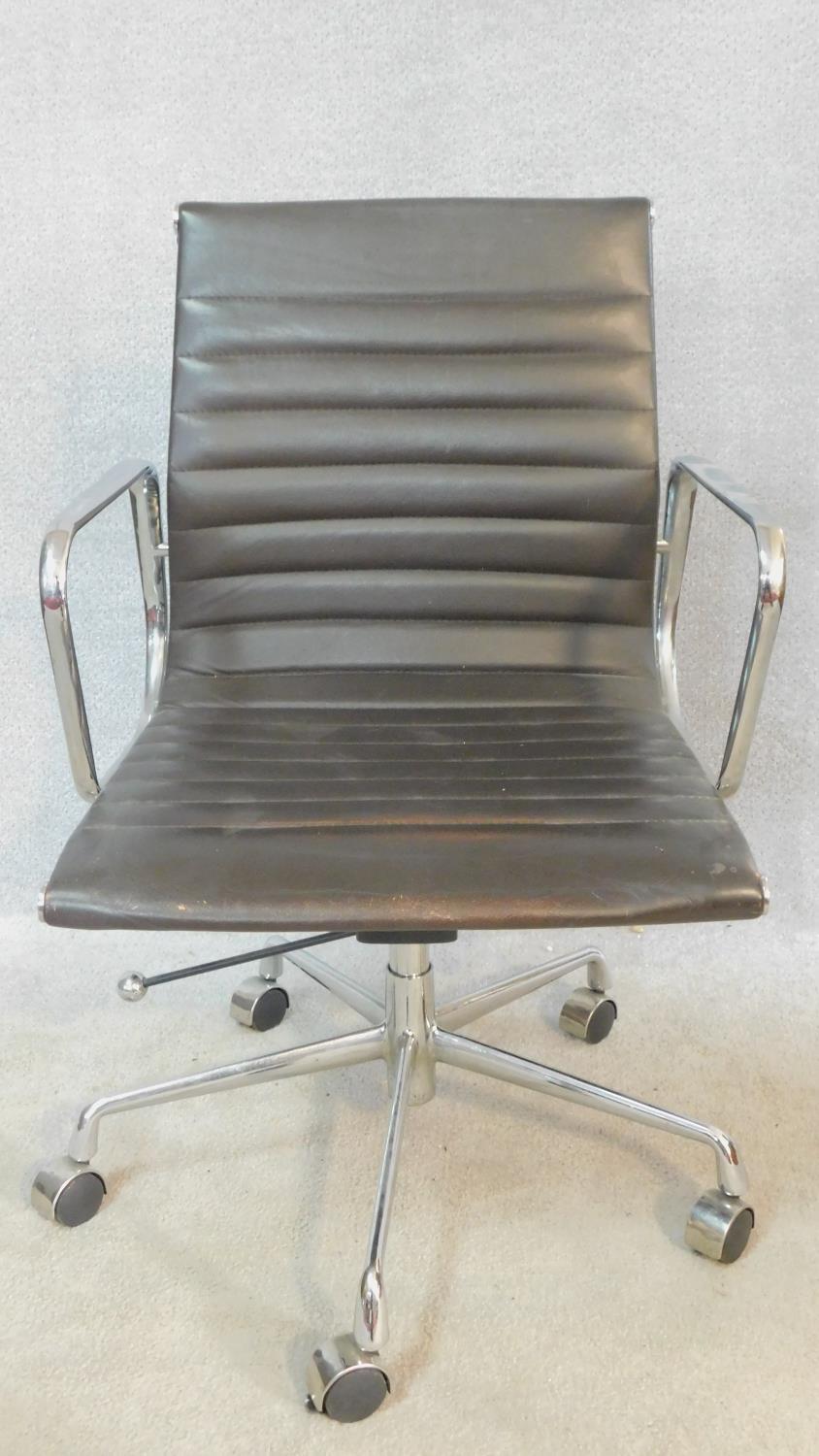 A vintage Charles and Ray Eames inspired Aluminium Group style office desk armchair in black