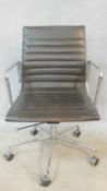 A vintage Charles and Ray Eames inspired Aluminium Group style office desk armchair in black