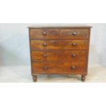 A 19th century figured mahogany chest of two short over three long drawers on turned supports. H.108