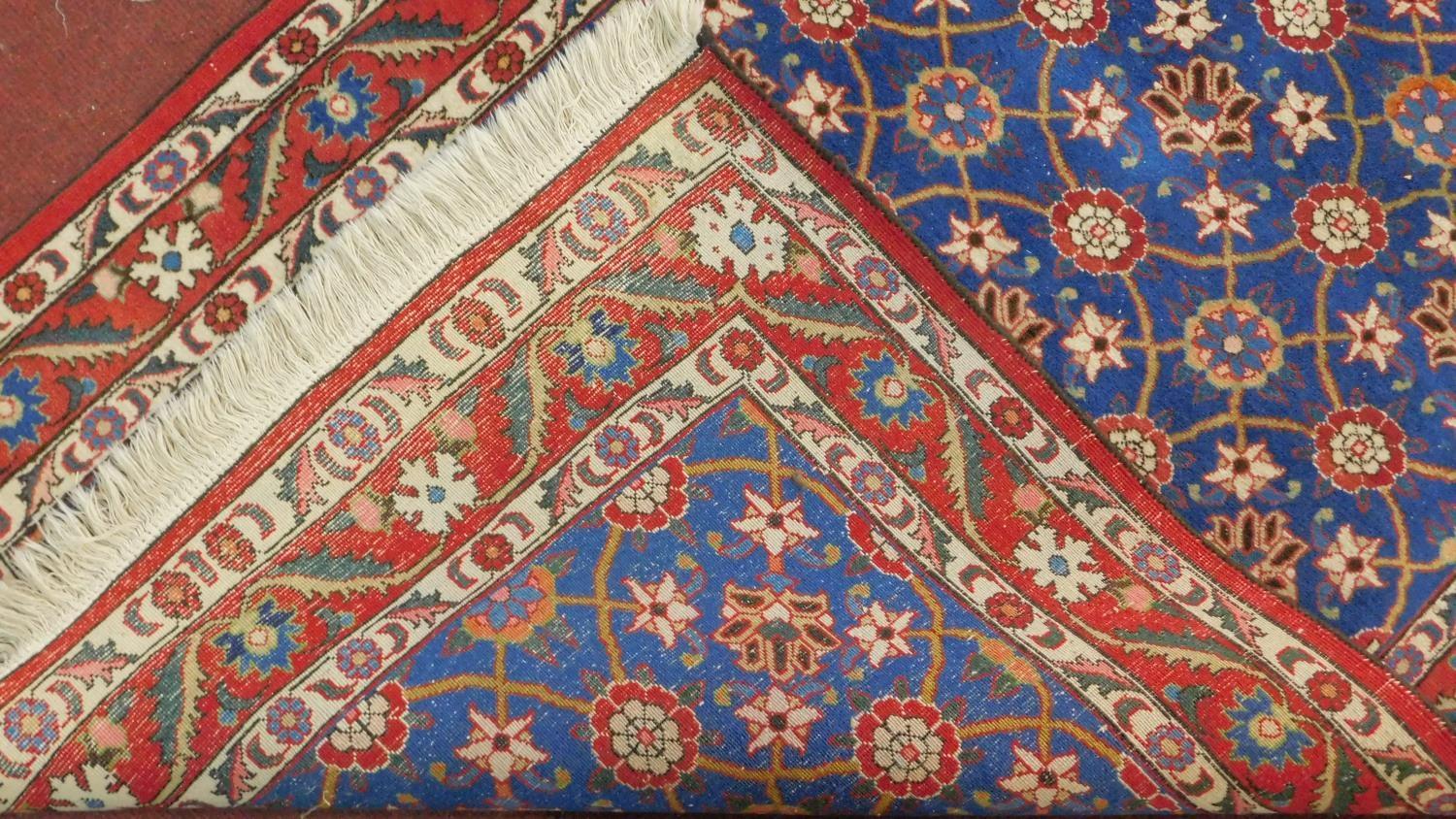 A Veramin Mina Khani style rug with repeating scrolling vine and floral decoration on a deep - Image 4 of 4