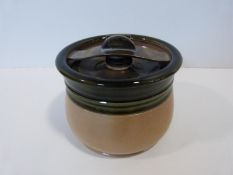 A green glazed stoneware ceramic tobacco jar by Royal Doulton with metal swivel patented mechanism