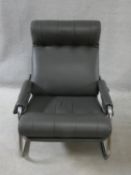 A vintage reclining armchair on chrome base in charcoal buttoned leather upholstery. H.82 W.65 D.