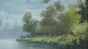 A gilt framed oil on canvas, river landscape, signed Mancini. 75x65cm