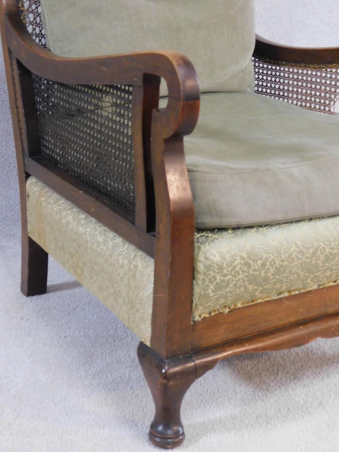 A mid century mahogany framed bergere armchair with squab cushions to seat and back. H.79 W.74 D. - Image 3 of 6