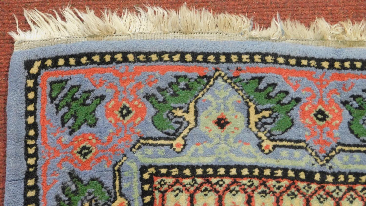 A Samarkand rug with central lozenge medallion on pale blue ground within a naturalistic floral - Image 3 of 4