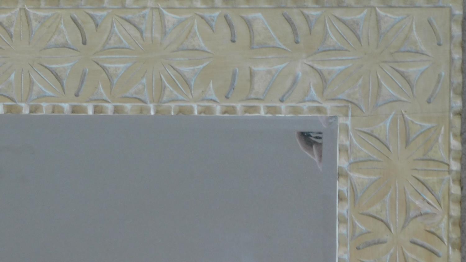 A vintage wall mirror in limed and carved frame fitted with bevelled plate. 122x92cm - Image 2 of 3