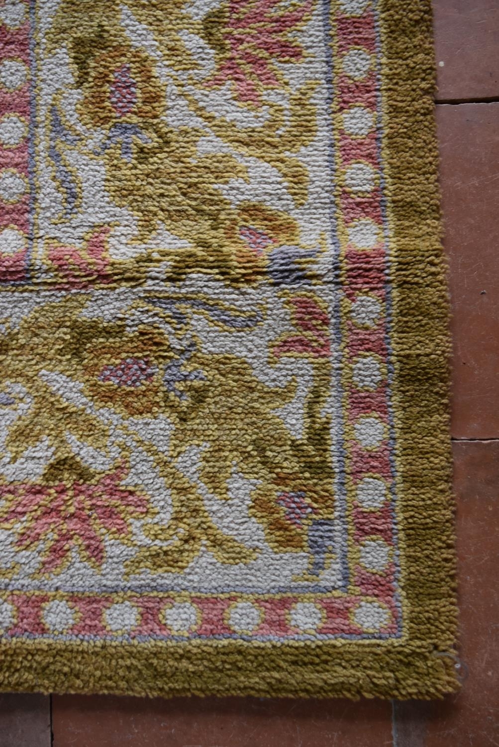 A vintage Spanish carpet with repeating scrolling floral design across the fawn field enclosed by - Image 3 of 5