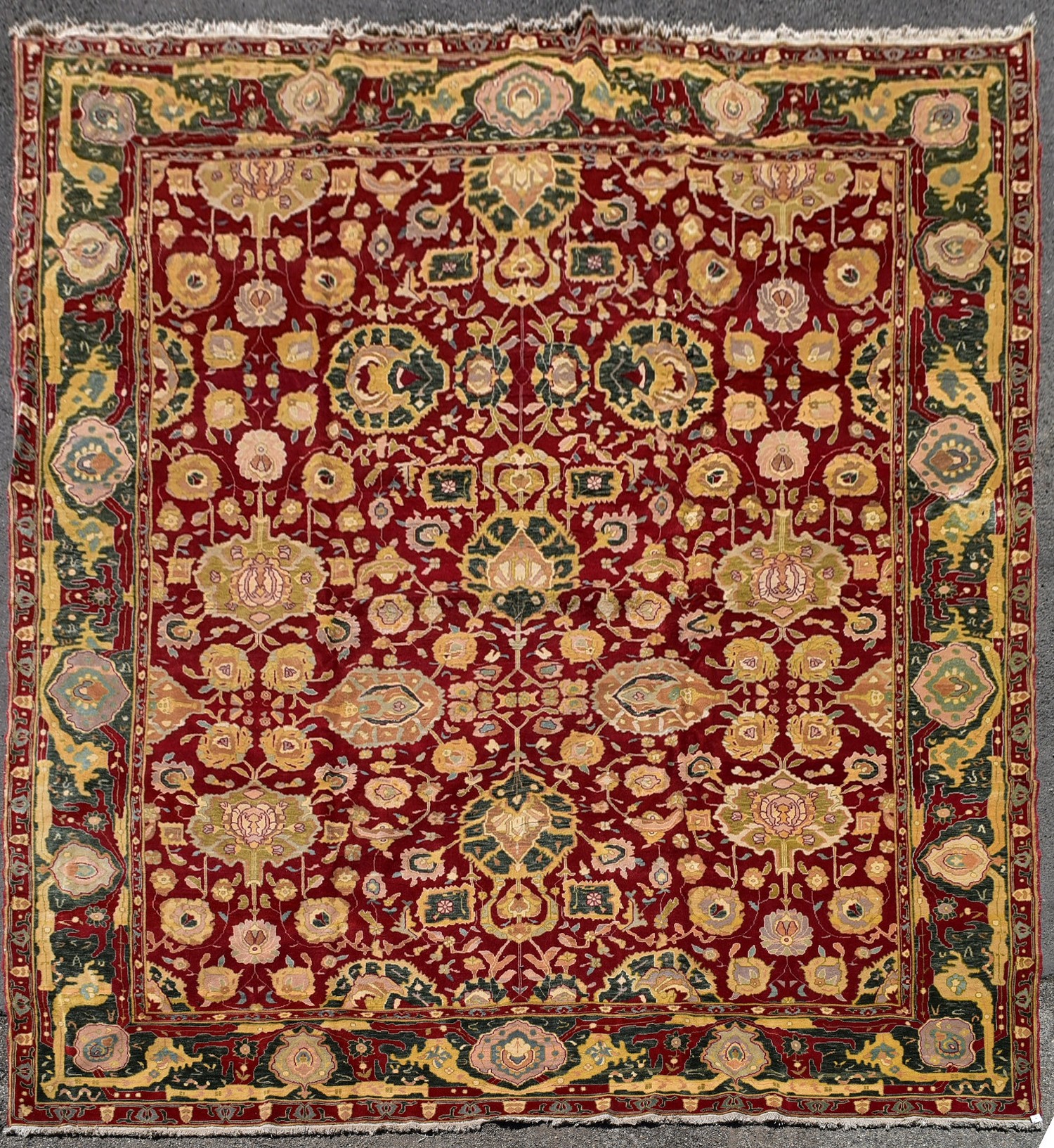 A fine large Agra carpet with all over repeating scrolling palmette and lotus flower decoration on a