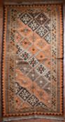 A Persian Kashkai Kilim with repeating diamond motifs in geometric multi borders. L.260xW.140cm