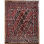 An Afghan Sumak rug with repeating diamond pattern across the field within geometric borders. L.