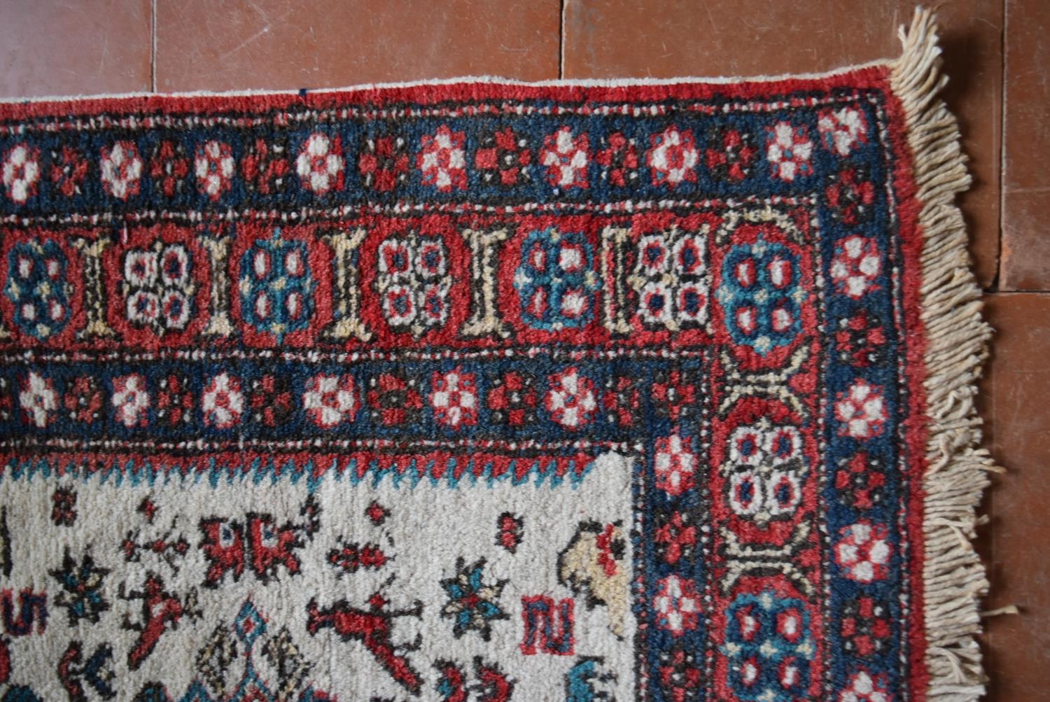 A Turkish Rug with repeating central medallions on ivory ground within stylised floral multi - Image 3 of 4