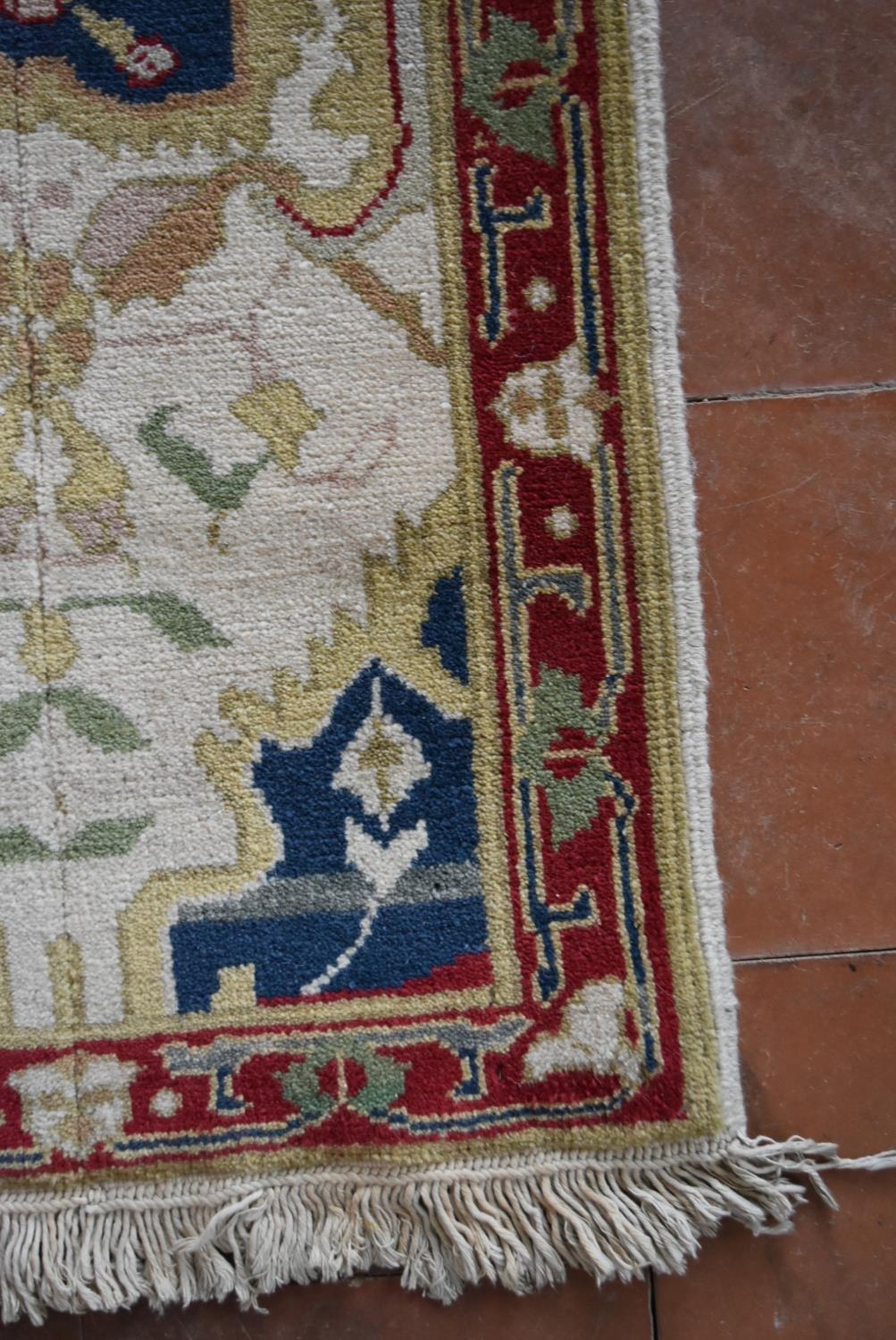 An Agra design runner with all over scrolling meandering stylised foliate decoration within floral - Image 3 of 5