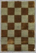 A contemporary silk & wool rug with bronze and silver chequerboard pattern. L.123xW.93cm