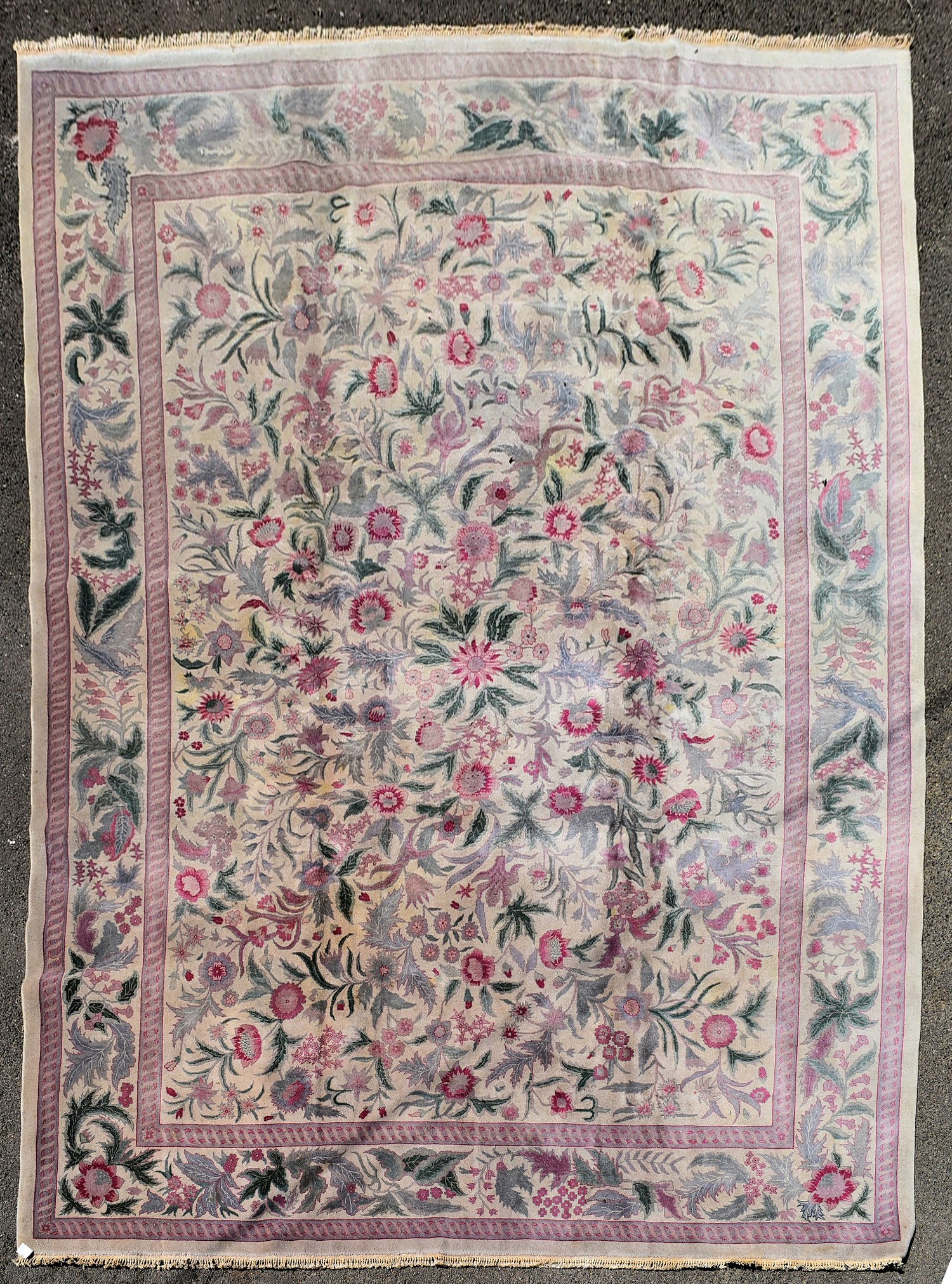 A William Morris design carpet in the Arts and Crafts manner with foliate and floral pattern