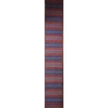 A long modern Kilim runner with bands in various hues of red and blue. L.400xW.70cm