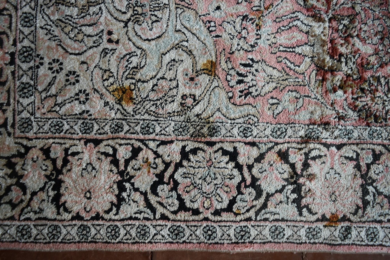 a Kashmir silk rug with floral medallion and spandrels on a salmon ground depicting animals in a - Image 3 of 4