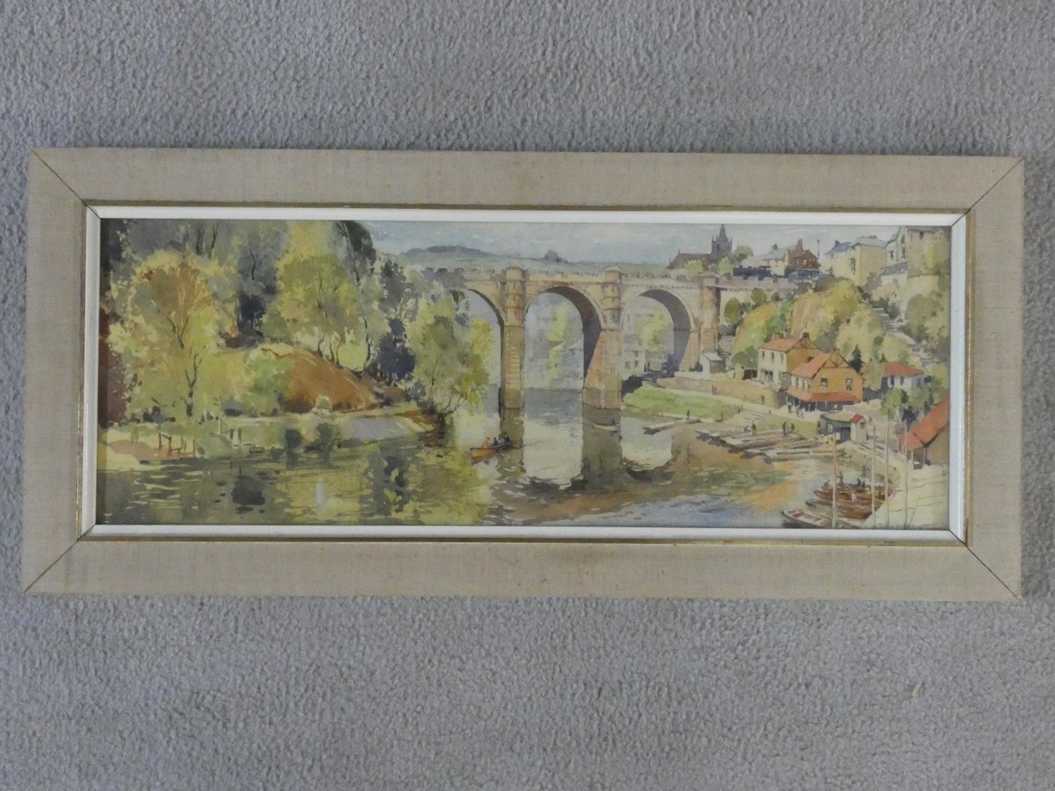 Jack Merriott (1901-1968) a framed and glazed watercolour, village with bridge on a river, signed