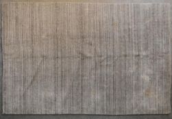 A contemporary linear rug in various shades of grey. L.256x170cm