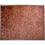 A contemporary carpet with allover scrolling interlocking pattern on a rouge field. L.240x206cm