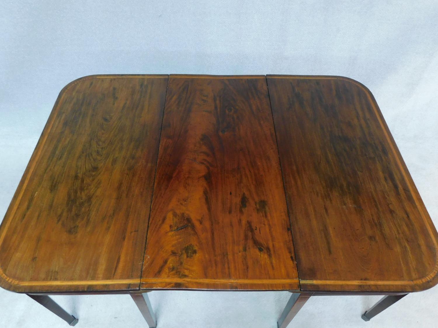 A late Georgian mahogany and satinwood strung D end dining table on square tapering supports and - Image 2 of 3