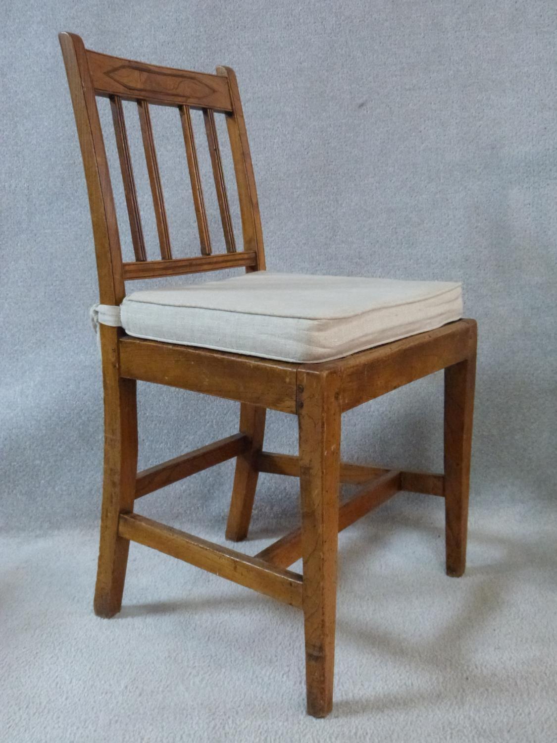 A set of four antique country elm dining chairs with carved rail backs and rush drop in seats. Three - Image 2 of 8