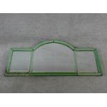 An Art Deco triptych mantel mirror with arched central plate flanked by rectangular plates in pale