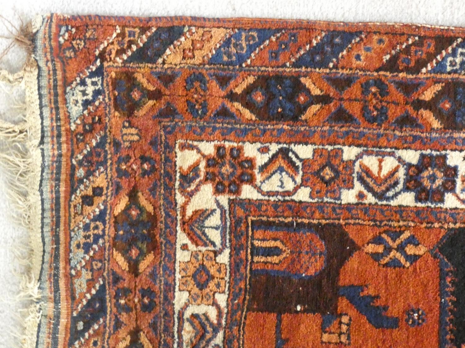 A Shirvan rug with central burgundy pole medallion on a midnight ground within stylised floral - Image 3 of 4