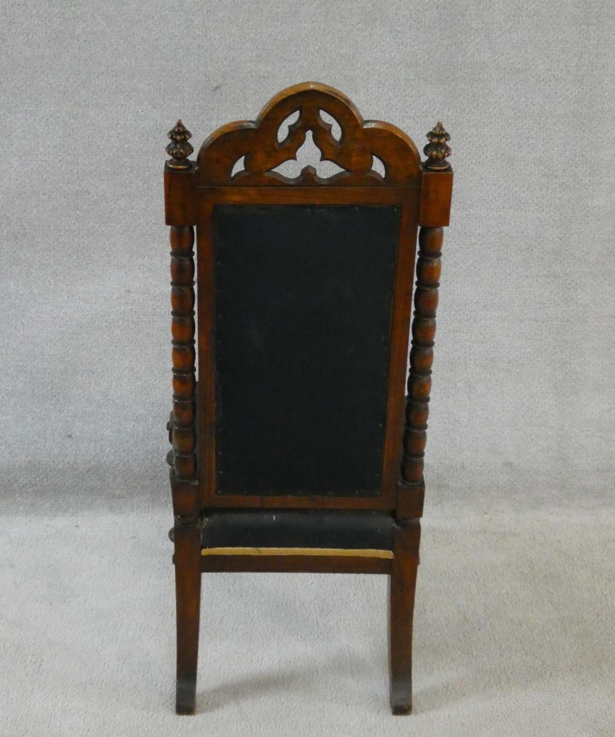 A late Victorian walnut Gothic carved prie dieu style side chair in floral tapestry upholstery. H. - Image 6 of 6