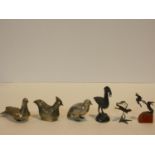 A collection of three Indian silver bird figures, a bronze figure group of fighting hares, a similar