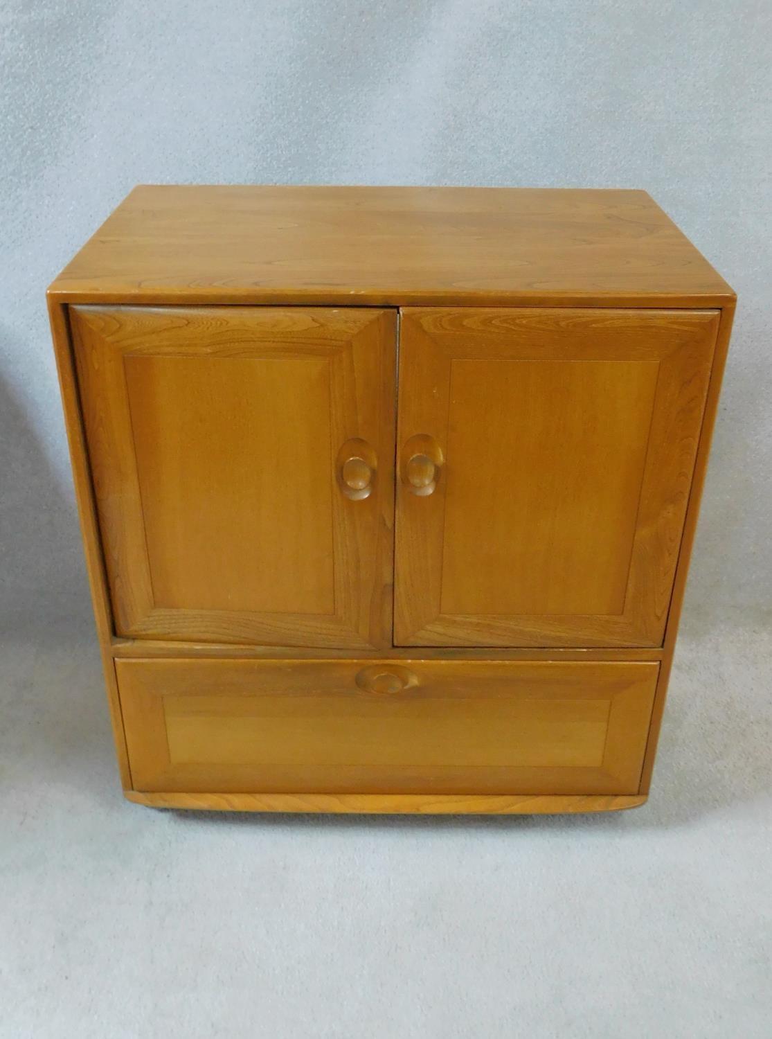 A vintage elm Ercol cabinet with panel doors and drop down base door fitted for HI Fi. H.94xW.85xL. - Image 2 of 13