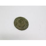 A ancient Roman coin with warrior figure on one side and bust on the other. D.1,6cm