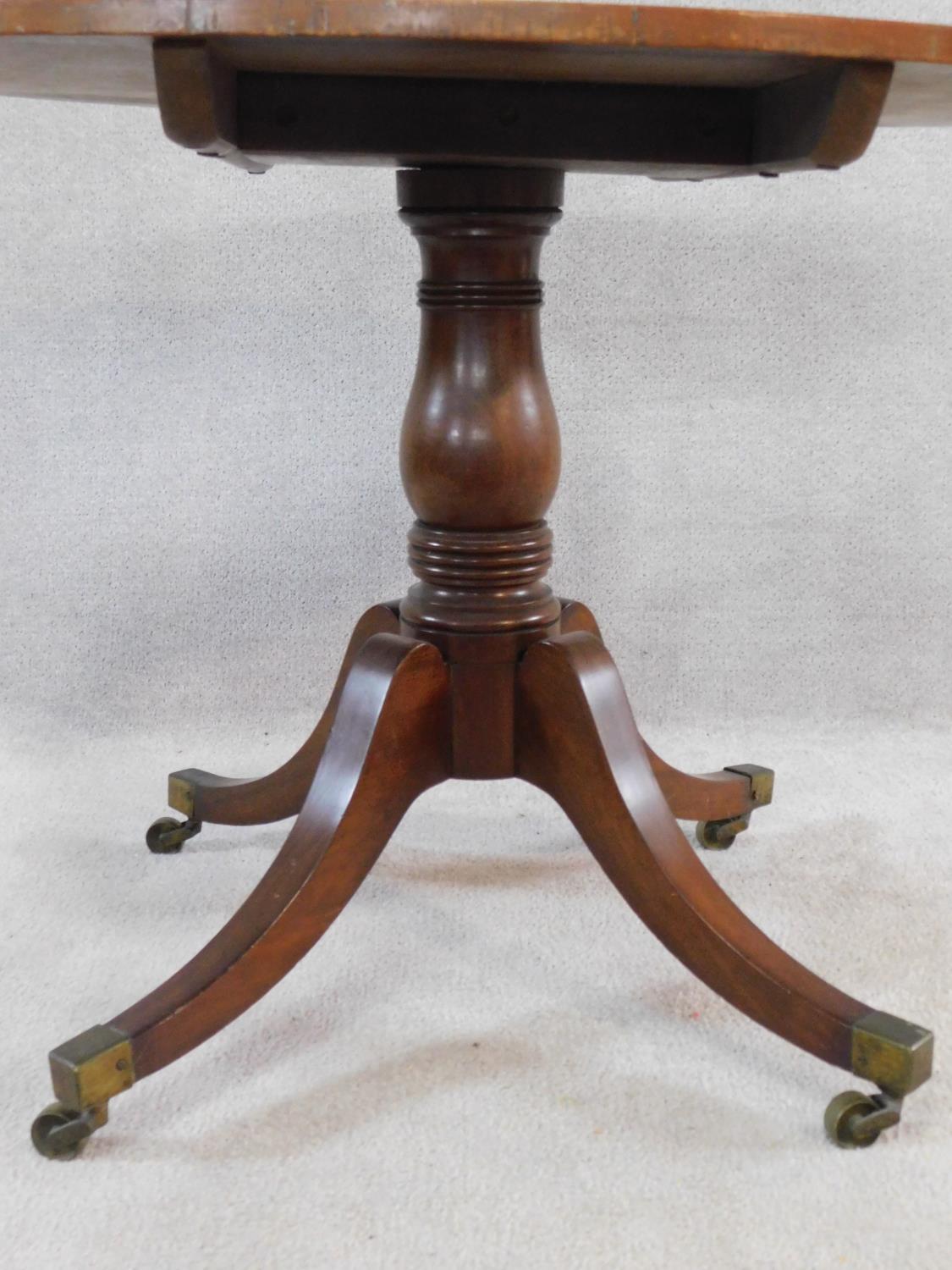 A 19th century mahogany tilt top tea table on swept quadruped supports terminating in brass cap - Image 3 of 5