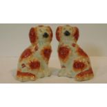 A pair of antique Staffordshire style dogs with hand painted detailing. H.19cm