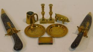 A collection of antique and vintage brass items. Including a WW1 trench art hinged book lighter with