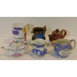 A collection of six antique and vintage jugs and tea pots. Inlcuding A Royal Doulton Lambeth Harvest