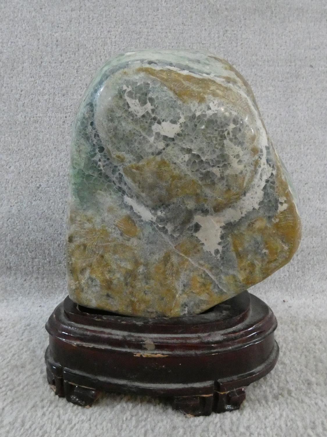 A large polished Fluorite crystal boulder mounted on a carved Chinese wooden stand. H.31cm - Image 2 of 4