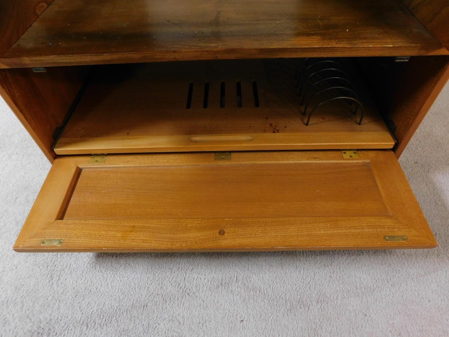 A vintage elm Ercol cabinet with panel doors and drop down base door fitted for HI Fi. H.94xW.85xL. - Image 4 of 13